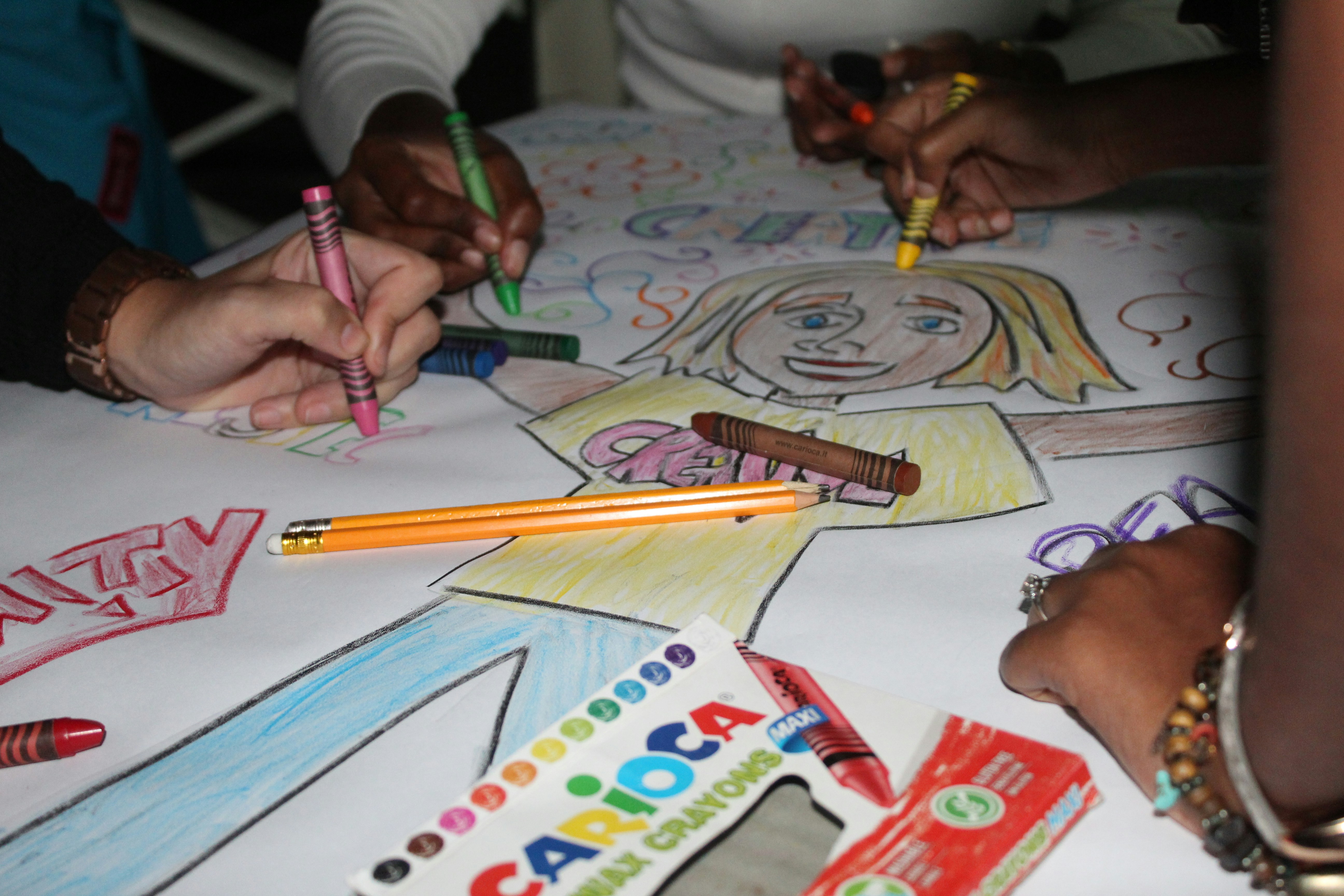 Children drawing together with colourful crayons, from The Shared Note’s original website